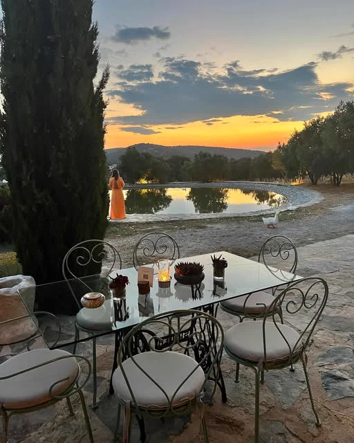 A table by the pond at sunset