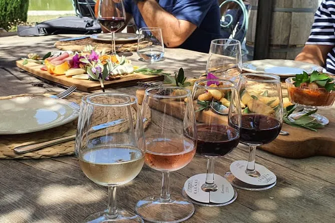 Wine glasses and a cheese board on a tasting table
